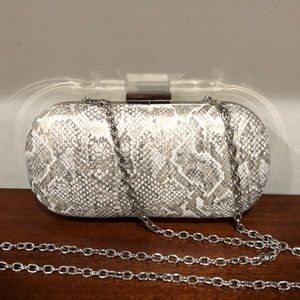 Gianni Bini women’s hard case clutch with chain- snake design oval shaped